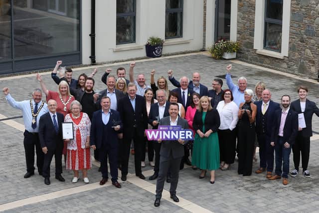 The joint winners of High Street of the Year, Coleraine and Newtownards join Chief Executive of Retail NI, Glyn Roberts and Parliamentary Under-Secretary of State for Northern Ireland, Lord Caine at the High Street Hero Awards