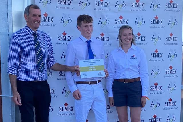 Ben Reid, Drumbo, was the 3rd placed junior overall, Pictured with John Jameson Holstein UK President and Lizzie Bradley, sponsor