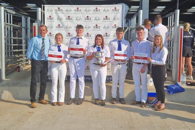 Members of the A team being presented with the winning cup and certificates with John Jameson, Holstein UK President and Lizzie Bradley, sponsor