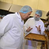 Minister Poots is pictured during a visit to Graham’s Bakery in Dromore with Timothy Graham.