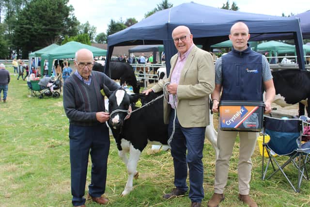 Enjoying the 'craic' at Clogher Show: Holstein breeder, Harold Nelson from Enniskillen with Crystalyx representatives David and Luke Morgan