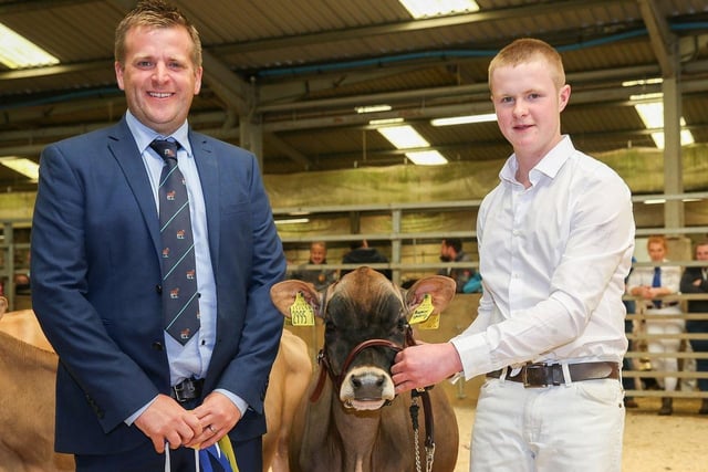 Tom McKnight exhibited the first placed Jersey calf Mostragee RT Premier Spritz ET. Included is judge Sam Wake. Picture: Jane Steel