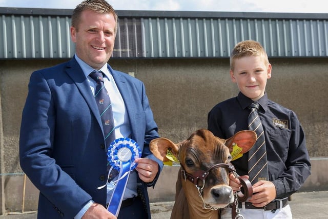 Charlie McKeeman, Bushmills, was the reserve champion Jersey showmanship competitor at the 19th multi-breed dairy calf show. He was congratulated by judge Sam Wake. Picture: Jane Steel