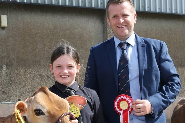 Elizabeth McCann won the honourable mention Jersey showmanship award at the 19th multi-breed dairy calf show, Dungannon. She was congratulated by judge Sam Wake. Picture: Jane Steel