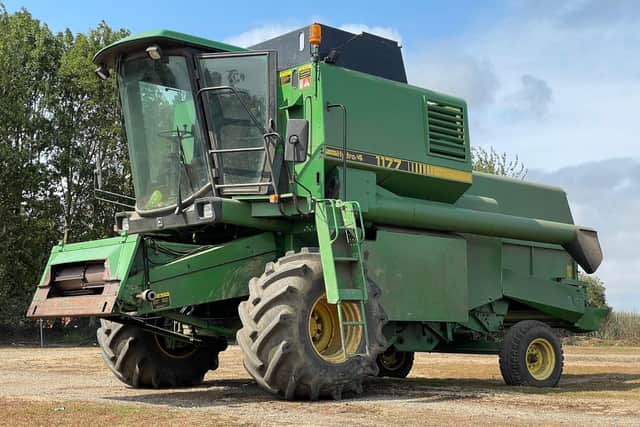 A John Deere 117 Hydro 4 combine harvester features in the auction.