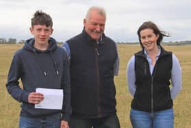 Under 25 stockjudging winners Matthew Sufferin, Maghera, first; and Mena McCloskey Dungiven, second, with master judge John Blackburn, Clogher, at the NI Aberdeen Angus Club's Open Day in Tyrella. Picture: Julie Hazelton