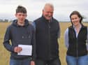 Under 25 stockjudging winners Matthew Sufferin, Maghera, first; and Mena McCloskey Dungiven, second, with master judge John Blackburn, Clogher, at the NI Aberdeen Angus Club's Open Day in Tyrella. Picture: Julie Hazelton