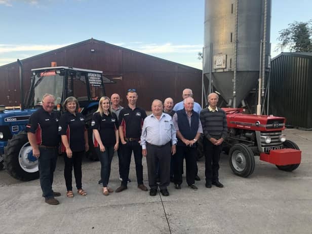 Right, Listooder men Dai Kennedy (second right) and Andrew Gill (centre) preparing to compete at the European Vintage and World Ploughing Contests in September. They are pictured with Listooder Ploughing Society committee and family members
