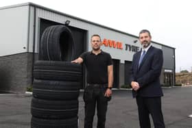 Ulster Bank business development manager Philip McNeill pictured with Anvil Tyre Centreâ€TMs Daniel Wethers.