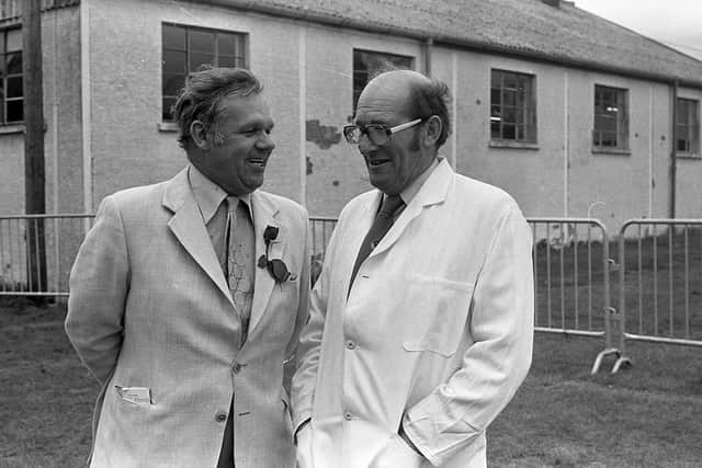 Auctioneer Arthur Robinson, chairman of the Northern Ireland branch of the Suffolk Sheep Society cracks a joke with judge, Mr William Stewart, from Bartlehill, Scotland, at the breed show and sale at Balmoral in August 1982. Picture: Farming Life/News Letter archives