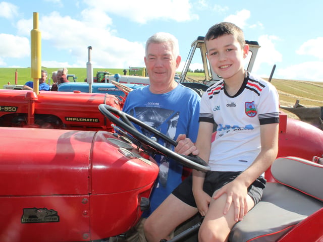 Joe McAnearney with his grandson Jacob at the threshing at Ballydown last Saturday