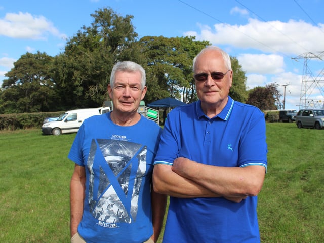 Joe McAnearney and Trevor McCallister watching the threshing at Ballydown