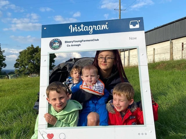 Tracey Rodgers and family enjoying the show of tractors in the field