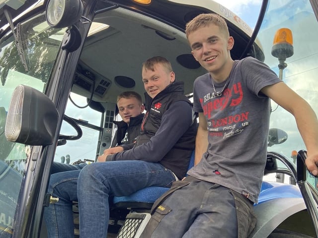 The lads sitting ready to go with the tractor run