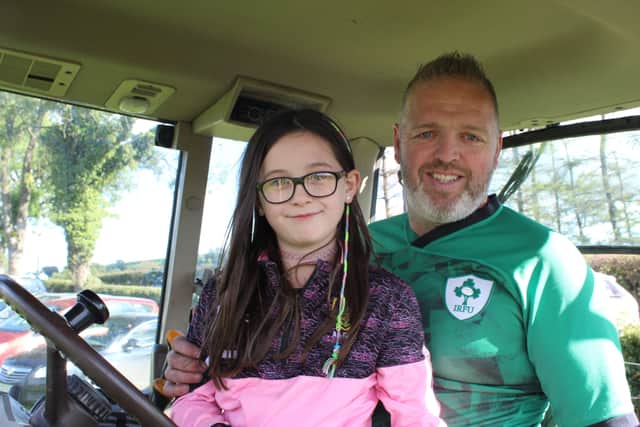 Eamon Downey and Annie pose for a photo at the tractor run last Saturday