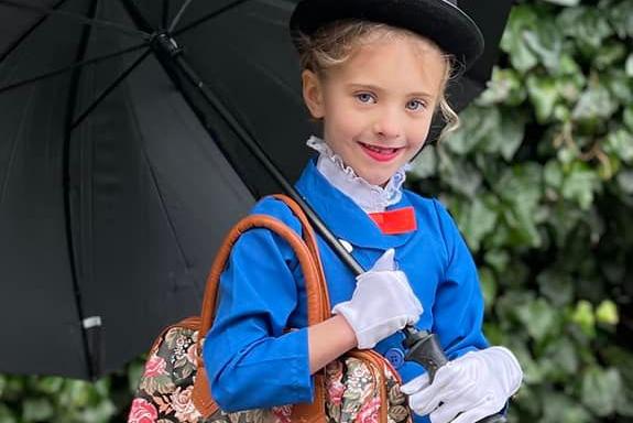 Lily-Rose Scott, six, dressed up the angelic nanny from the book series Mary Poppins.