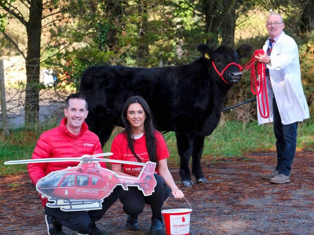 Coltrim Evana X747 will be raffled for charity. Ivan and Nicole Forsythe are pictured with Damien McAnesie from Air Ambulance Northern Ireland. The Laurel House Chemotheraphy Unit in Antrim will also benefit from the proceeds of the raffle.Picture: Columba O’Hare/Newry.ie