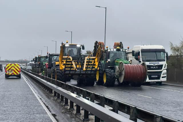 14/4/26: Fuel protestors slowly driving tractors and heavy vehicles, block the Sydenham bypass city-bound close to Belfast City Airport. Picture: Michael Cooper