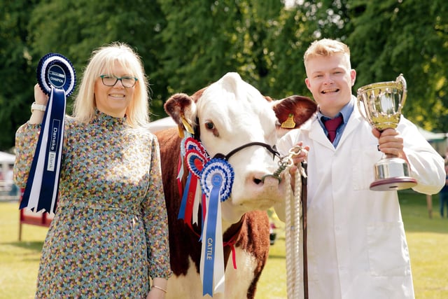 Ann Armstrong, Danske Bank, and Marcus Murdock, from Shinn, Newry, with Mr Murdock's Hereford cow, winner of the Beef Interbreed championship at Lurgan Show. Picture: Cliff Donaldson