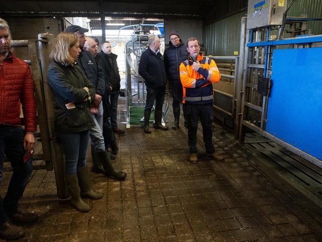 Explaining aspects of farm policy during the UGS visit to Workman Farms