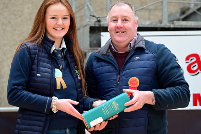 Judge William Smith, Millbrook Herd, County Meath, receives a token of appreciation from Rachel Boyce, secretary, NIYLB. Picture: Alfie Shaw, Agri-Images