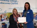 CAFRE Enniskillen Campus Certificate in Higher Education student Judith Todd (Dromore, Co Down) receives a bursary from Ruth Morrison, Downpatrick Racecourse.