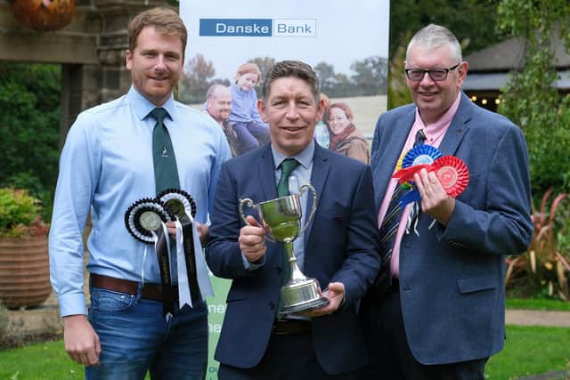 Confirming sponsorship of next week’s sale are Rodney Brown, Danske Bank, centre, with Jonny Lyons, chairman, and John Martin, secretary, Holstein NI. Photograph: Columba O'Hare/ Newry.ie