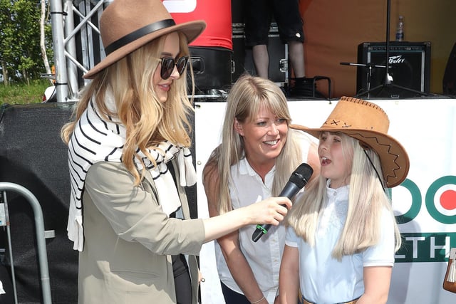 Katharine Walker from Cool FM interviewed third place winners in the Most Appropriately Dressed competition, Lucy and Catrina Prior from Bangor.