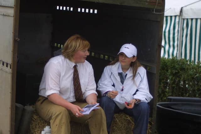 Claire Hunter and Karen Getty are pictured taking a well earned break during the Antrim Show in July 2002. Picture: News Letter archives/Kevin McAuley