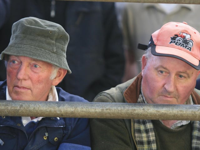 We were wondering if any of our readers might be able to identify those in the photographs.