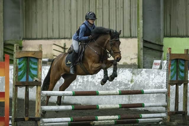 Annie Davis jumping Rubert. (Pic: Derek McClean)