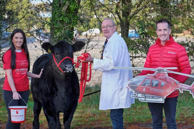 The Forsythe family from Moneymore are raffling Coltrim Evana X74 for charity. Ivan and Nicole Forsythe are pictured with Damien McAnespie, Air Ambulance Northern Ireland. The Laurel House Chemotherapy Unit at Antrim Area Hospital will also benefit from the proceeds of the raffle in memory of Keith Forsythe. Picture: Columba O’Hare/Newry.ie
