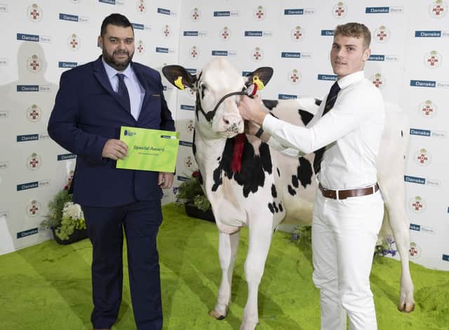 At the Winter Fair held at the Eikon Complex, Balmoral, the Senior and Mature Showmanship class was won by Alex Tinney from Letterkenny who is pictured receiving his award from Denis Hunter, Agribusiness Advisor, Danske Bank.
