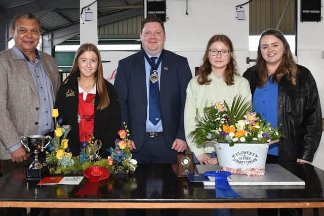 Winners of the 16-18 section in the floral art competition with judge, Gregory Baptie (left), YFCU president, Stuart Mills (centre), Kerri Ann Curran, Power NI (left)