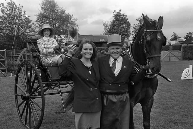 Pictured in May 1992 is the News Letter’s Vivienne Marshall who is seen presenting the anniversary trophy to Jonathan Carnduff of Millisle, Co Down, who was the overall winner in the Private Driving Class with his horse Woodside Jasper at the Balmoral Show. Looking on is the judge, Margaret Eisner of Maidenhead. Picture: News Letter archives/Darryl Armitage