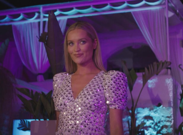 <p>Love Island host Laura Whitmore arrives to kill the vibe at the VIP party with the result of the public vote (ITV)</p>