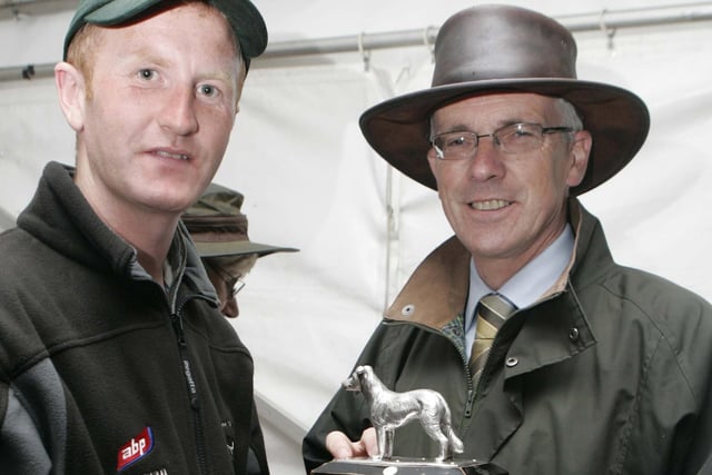 John Henning, Northern Bank, presents Michael Gallagher with his prize at the international sheep dog presentation of prizes at McQuillan's farm Masserene, Antrim. Picture: Steven McAuley/Kevin McAuley Photography Multimedia