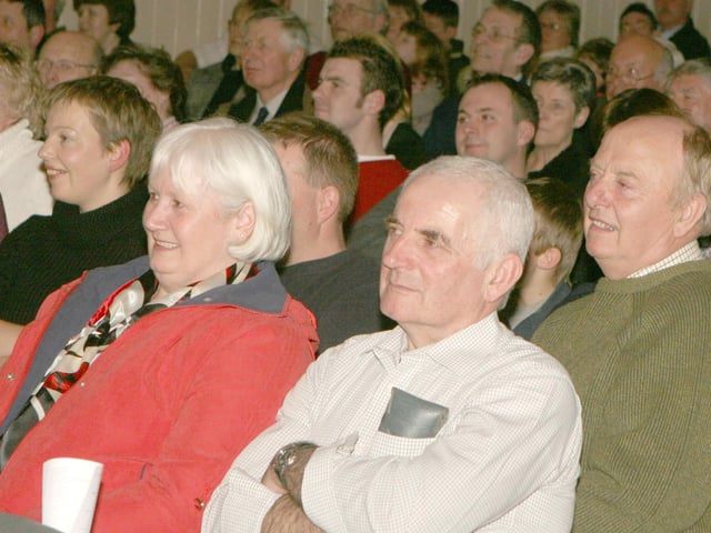 We were wondering if any of our readers might be able to identify those in the photographs.