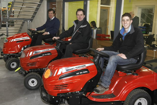 Chris Wilkinson, Alan Milne and John Campbell on the MF range of lawnmowers at the open night at Newry. Picture: Steven McAuley/Kevin McAuley Photography Multimedia