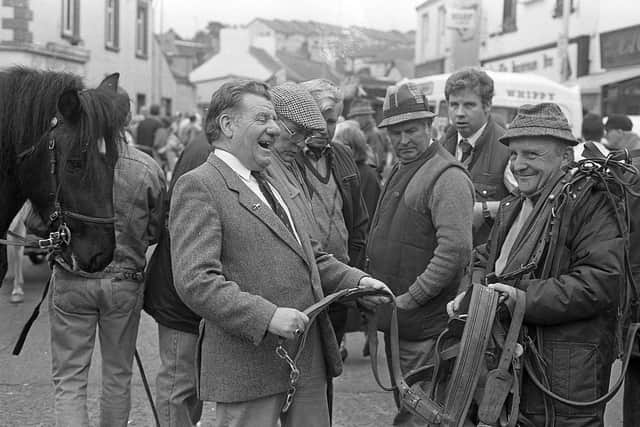Pictured at the end of September 1992 at the Dromore Horse Fair is ‘Julie’ Hunter from Carryduff who is seen here enjoying a lighter moment at the fair with an interested observer over his shoulder. Picture: News Letter archives/Darryl Armitage