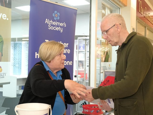 Emily Wilson from Alzheimer’s Society signposting shoppers to local support services during the event.