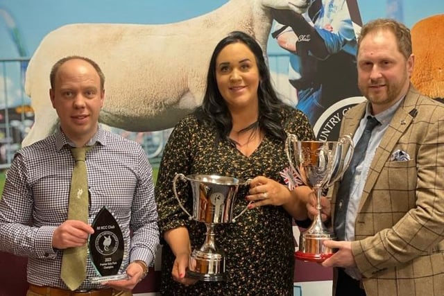 Kelly and Norman Robinson receiving the Allanshaws and Soutra cups for the Champion at the premiere sale, from Chairman Allister McNeill.