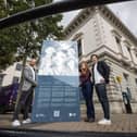 Councillor Joe Duffy, Chair of Belfast City Council’s City Growth and Regeneration Committee, Chloe Glass, Architectural Assistant and James Grieve, Architect, pictured with one of 29 new trilingual interpretative panels (English, Irish, and Ulster Scots) installed on the exterior of the Assembly Rooms with support from World Monuments Fund (WMF) as part of a conservation project to safeguard the building.