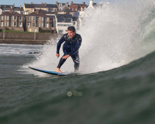 Andy Hill surfing in Portrush