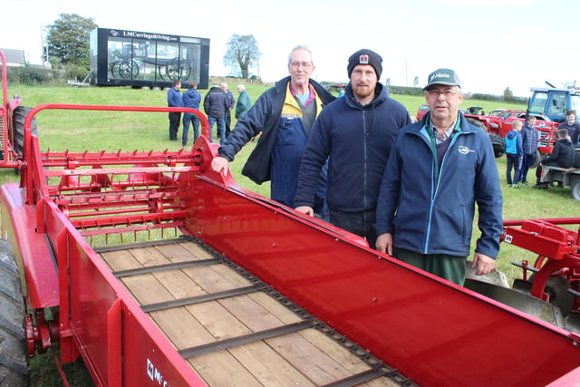 Admiring this vintage manure spreader (from left) Trevor Ross from Rathfriland with Jeffrey and Graham McKee from Kilkeel