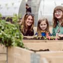 Sharon Crainey, operations leader, The Conservation Volunteers NI, Ella, Malvern Primary School and Deputy Lord Mayor of Belfast, Councillor Áine Groogan, at the launch of The BUG (Belfast’s Urban Garden) at Union and Kent Street, on a section of the site that will become Belfast Stories in 2029