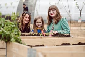 Sharon Crainey, operations leader, The Conservation Volunteers NI, Ella, Malvern Primary School and Deputy Lord Mayor of Belfast, Councillor Áine Groogan, at the launch of The BUG (Belfast’s Urban Garden) at Union and Kent Street, on a section of the site that will become Belfast Stories in 2029