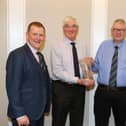 John Martin receives a presentation in recognition of his 25 years as Holstein NI secretary. Included are Wallace Gregg, chairman, Holstein UK; David Perry, president, and Jonny Lyons, chairman, Holstein NI. Picture: Kevin McAuley