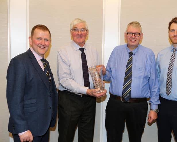 John Martin receives a presentation in recognition of his 25 years as Holstein NI secretary. Included are Wallace Gregg, chairman, Holstein UK; David Perry, president, and Jonny Lyons, chairman, Holstein NI. Picture: Kevin McAuley