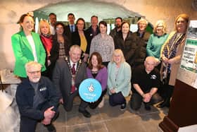 The Mayor of the Causeway Coast and Glens, Cllr Ivor Wallace, councillors Cara McShane and Cllr Margaret-Anne McKillop, and council staff, with Stella Byrne from The National Lottery Heritage Fund, and members of the Friends of Ballycastle Museum.